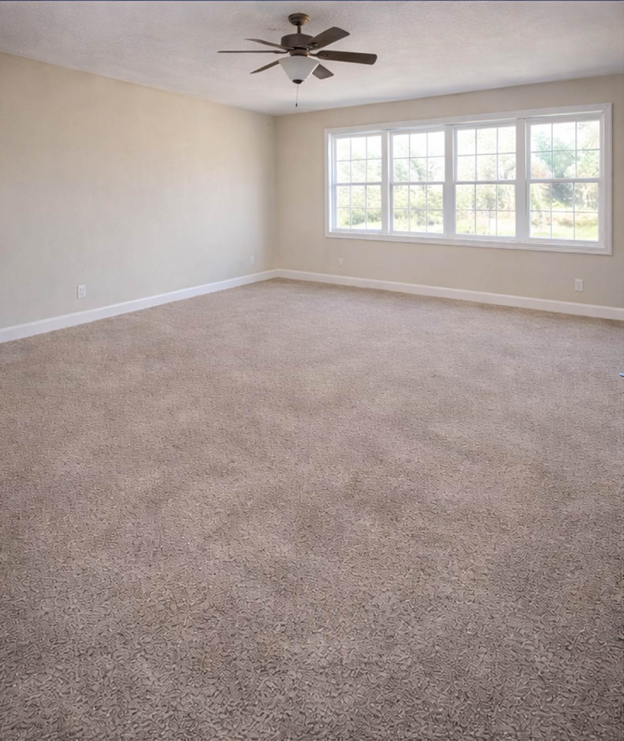 move-in ready, clean, empty carpeted bedroom with windows
